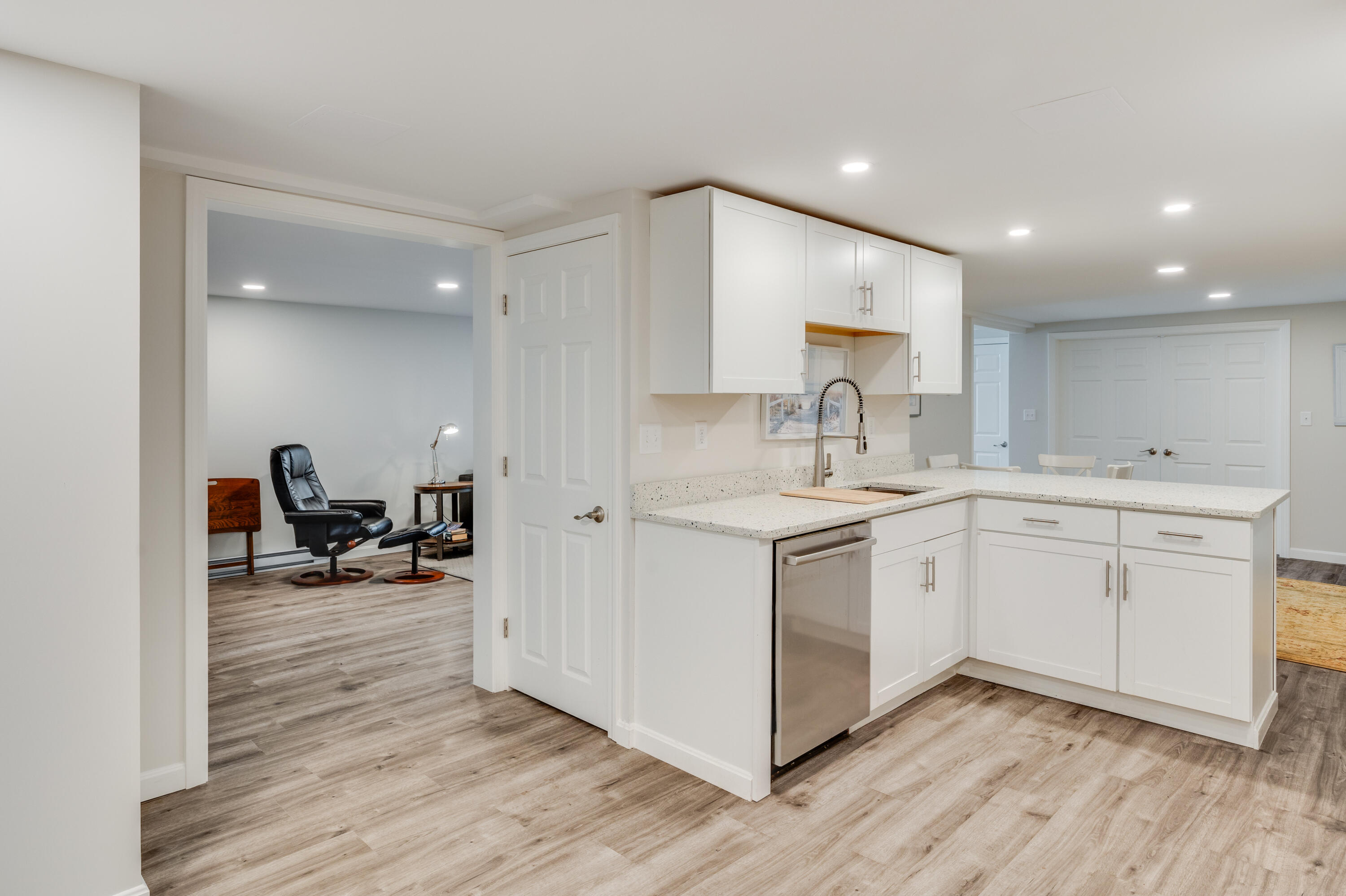 240 Braggs Lane Barnstable, MA 02630 - Photo 40 of 54 a kitchen with a sink cabinets and wooden floor
