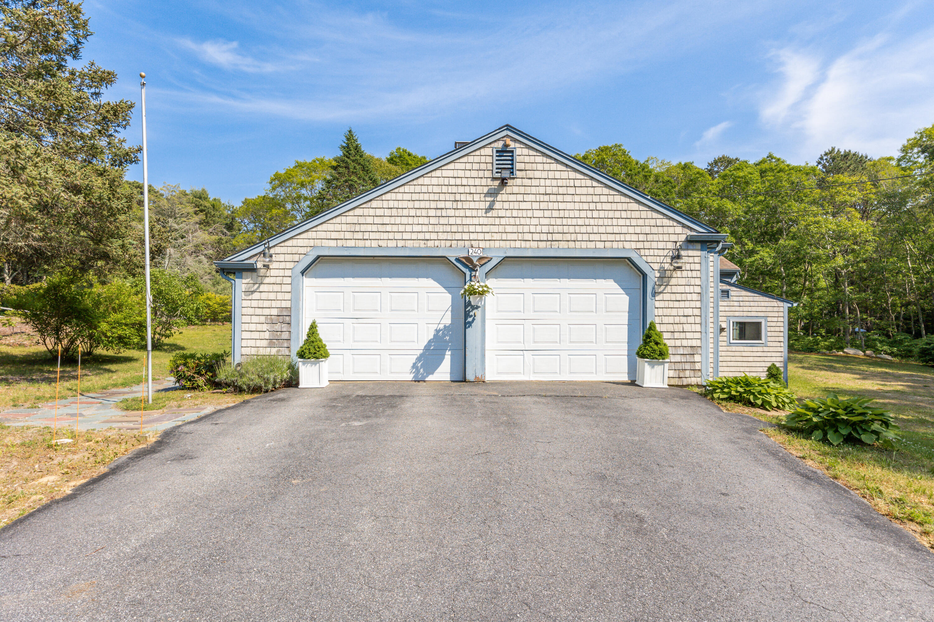 240 Braggs Lane Barnstable, MA 02630 - Photo 50 of 54 a view of a house with a yard and large trees