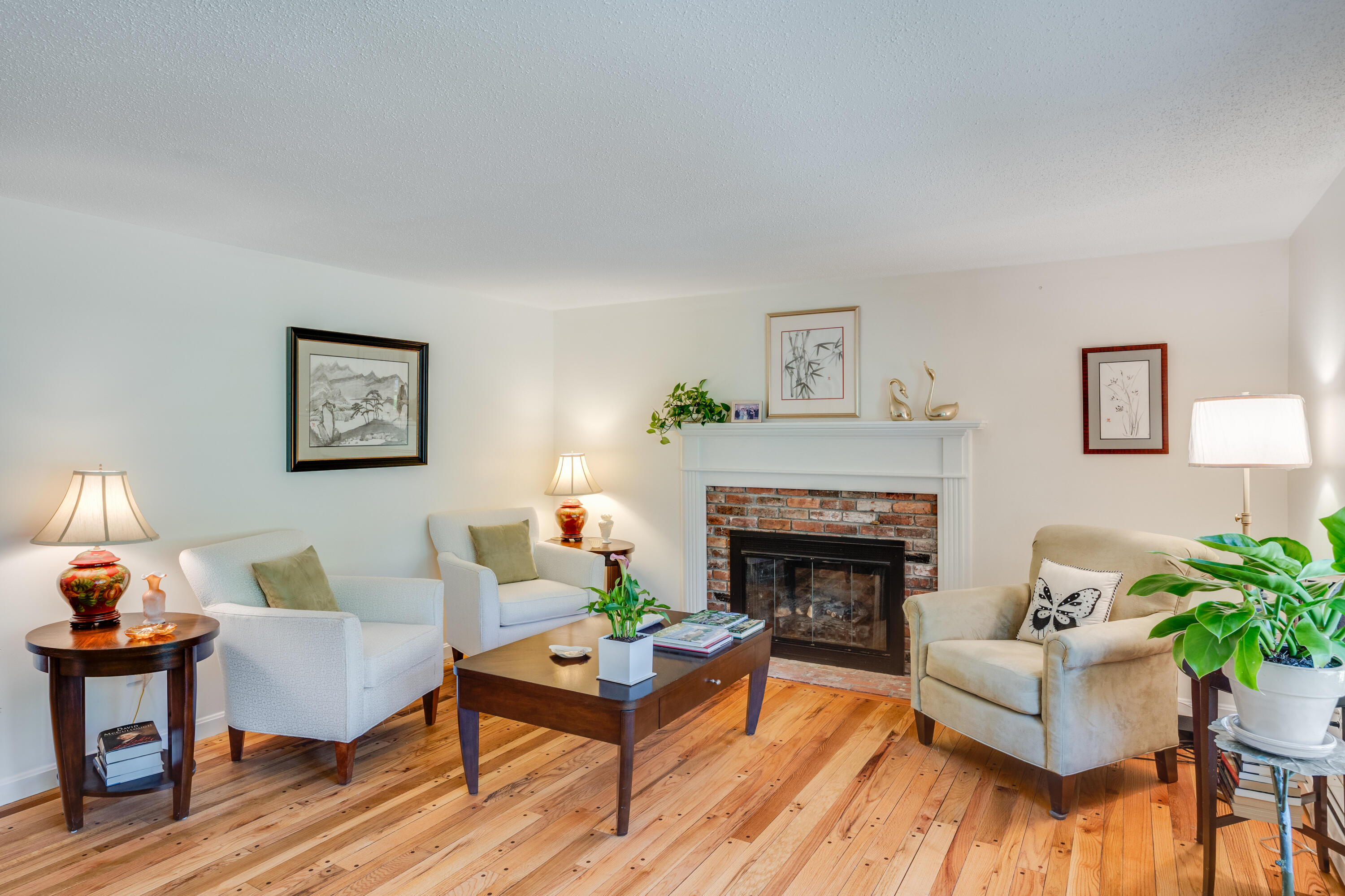 240 Braggs Lane Barnstable, MA 02630 - Photo 6 of 54 a living room with furniture and a fireplace