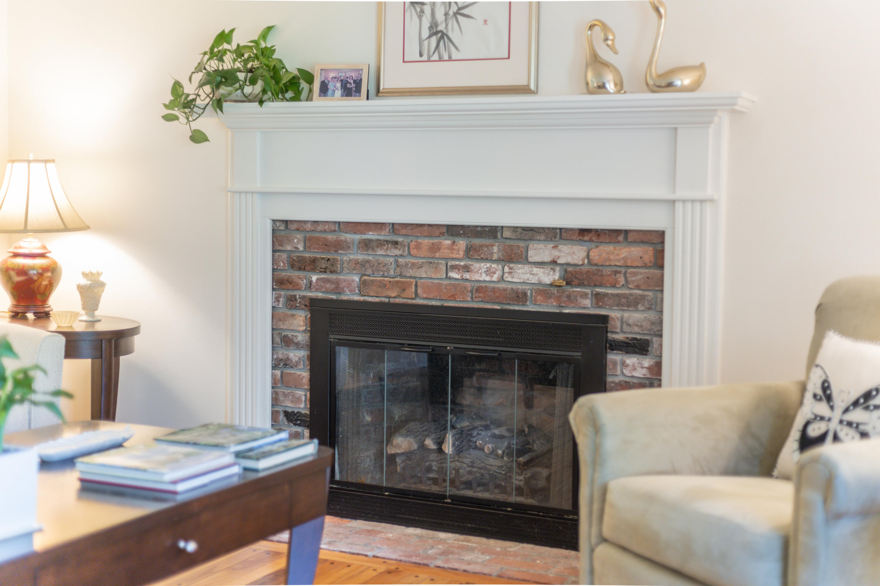 240 Braggs Lane Barnstable, MA 02630 - Photo 7 of 54 a living room with furniture and a fireplace