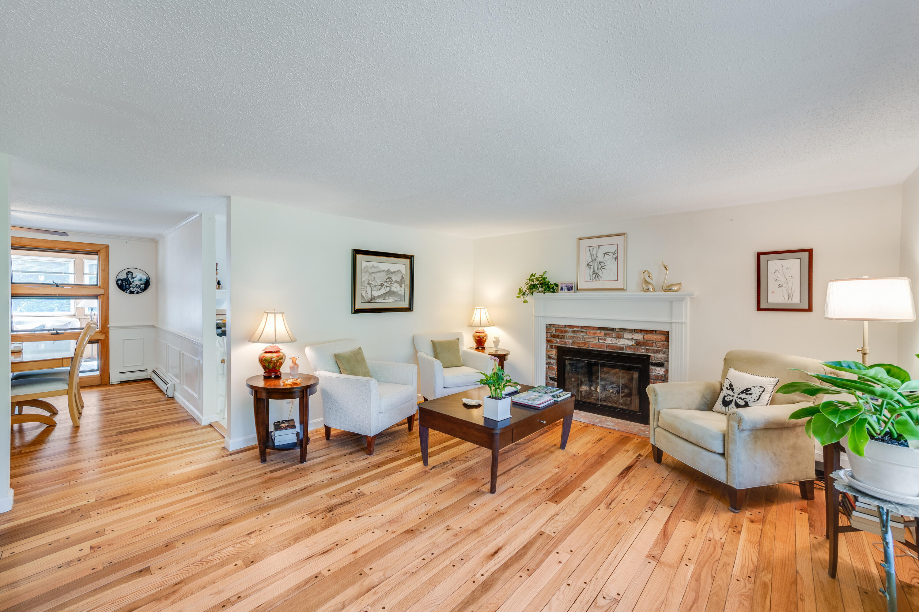 240 Braggs Lane Barnstable, MA 02630 - Photo 8 of 54 a living room with furniture and a fireplace