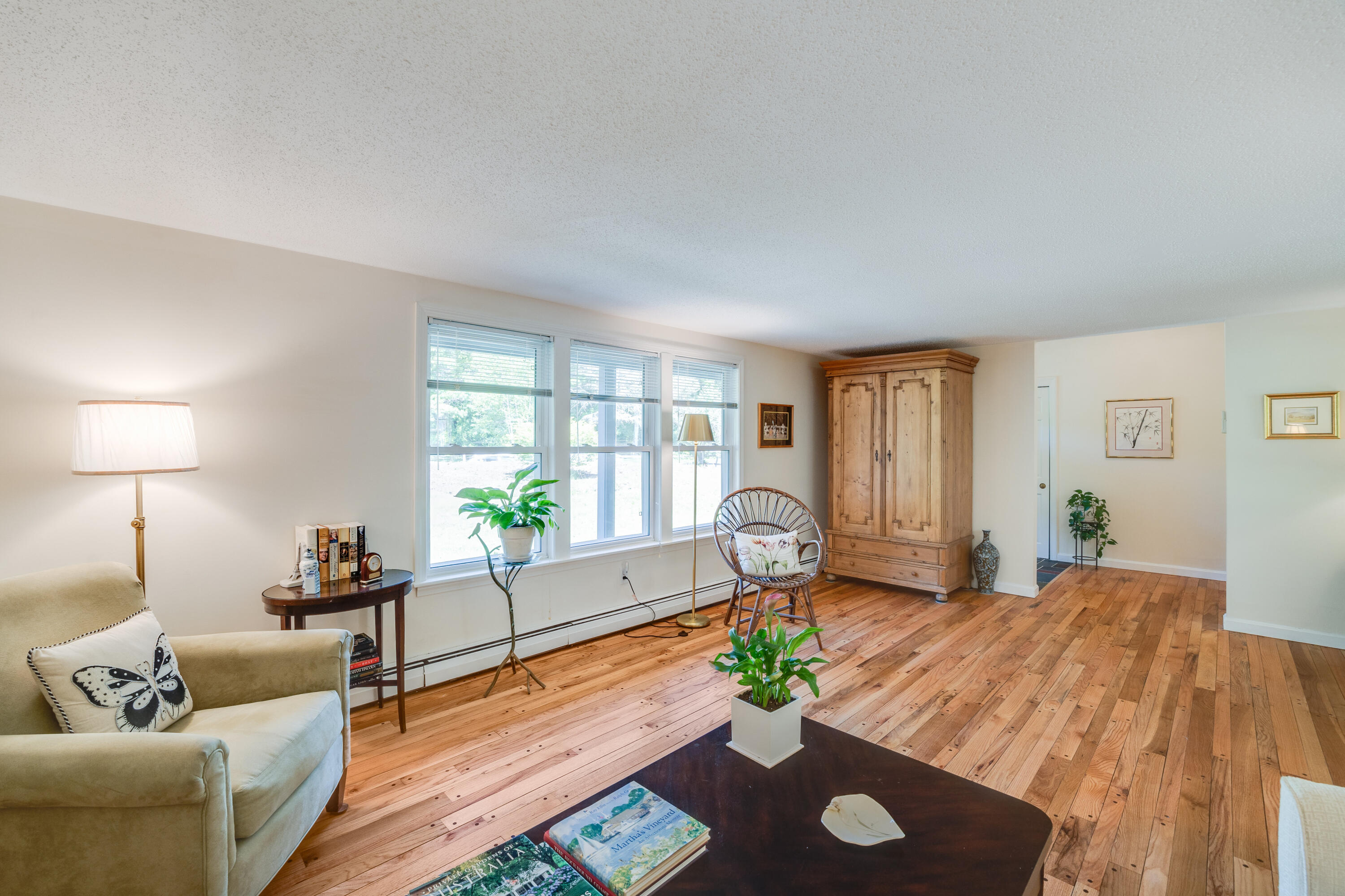 240 Braggs Lane Barnstable, MA 02630 - Photo 9 of 54 a living room with furniture and a wooden floor
