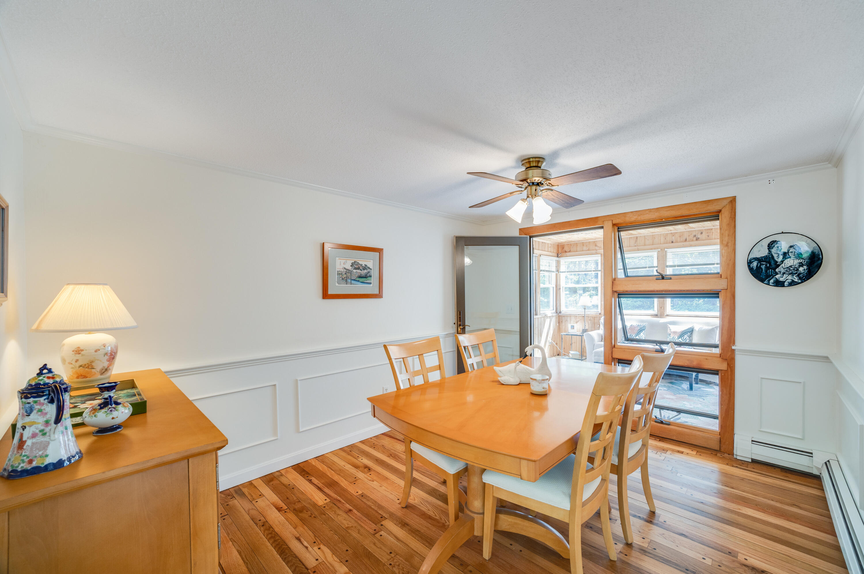 240 Braggs Lane Barnstable, MA 02630 - Photo 10 of 54 a dining room with furniture a chandelier and wooden floor