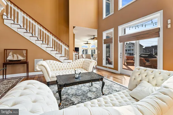 a living room with furniture fireplace and a flat screen tv