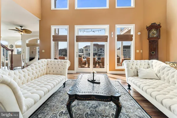 a kitchen with stainless steel appliances granite countertop a sink a stove and a wooden cabinets