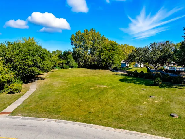 a view of swimming pool with table and chairs