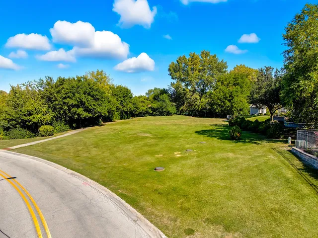 a view of a yard with swimming pool