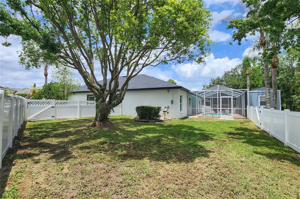 7027 Frascati Loop Wesley Chapel, FL 33544 - Photo 28 of 28 a view of a house with a yard