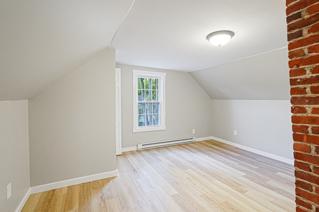 72 Main Street Pepperell, MA 01463 - Photo 16 of 26 an empty room with windows
