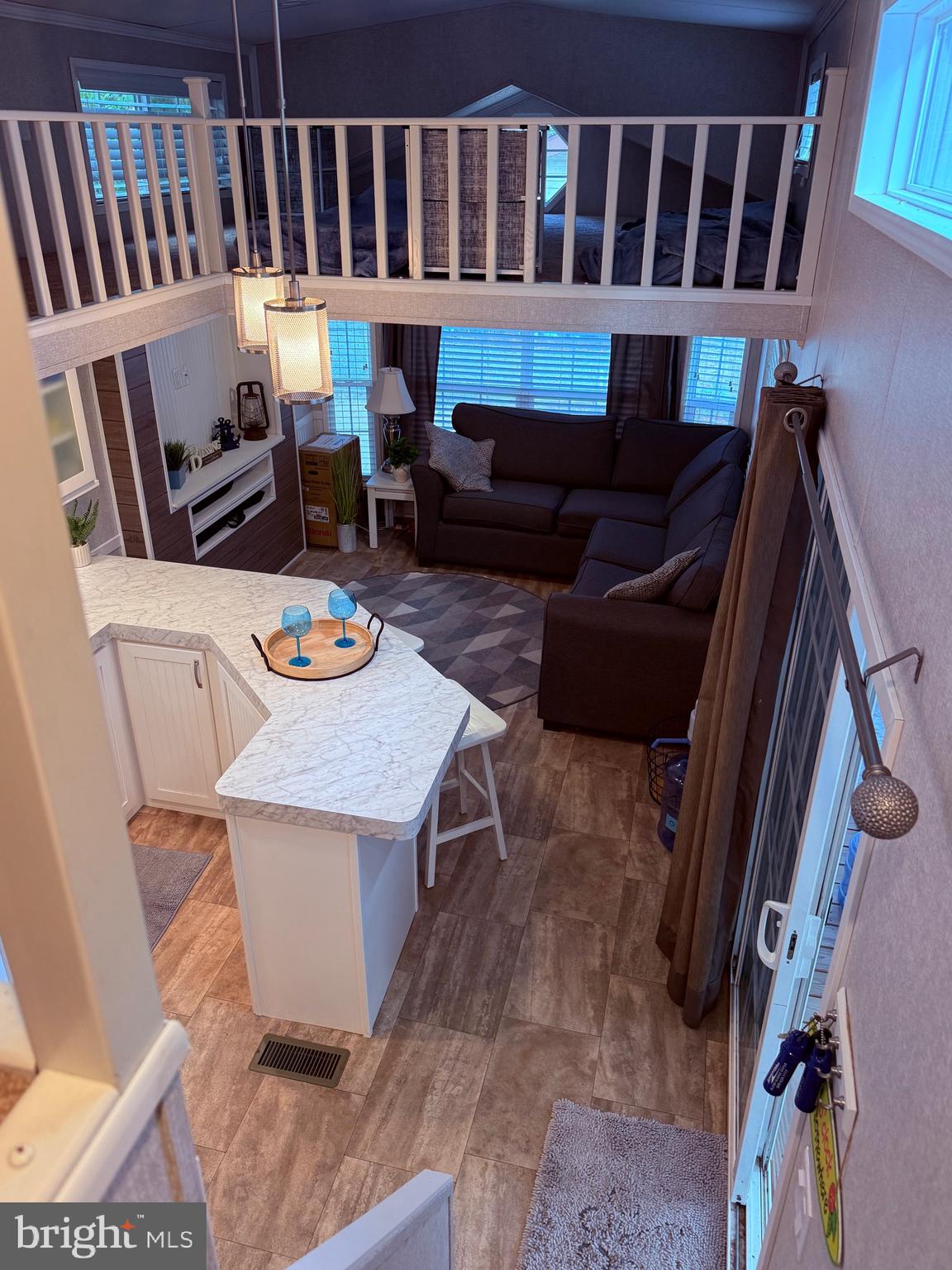 515 Corsons Tavern Road, Unit D49 Ocean View, NJ 08230 - Photo 12 of 19 looking down from loft