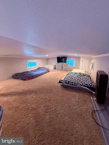 a bedroom with a bed and chair