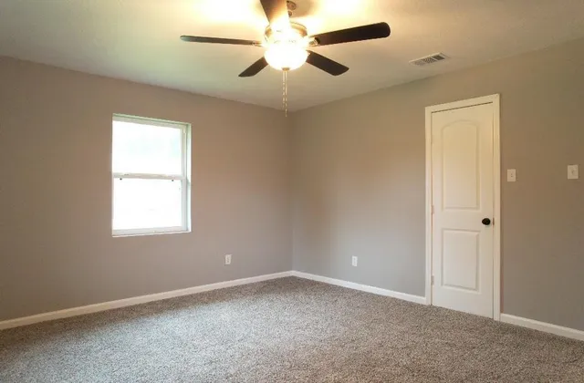 a bathroom with a sink toilet and vanity
