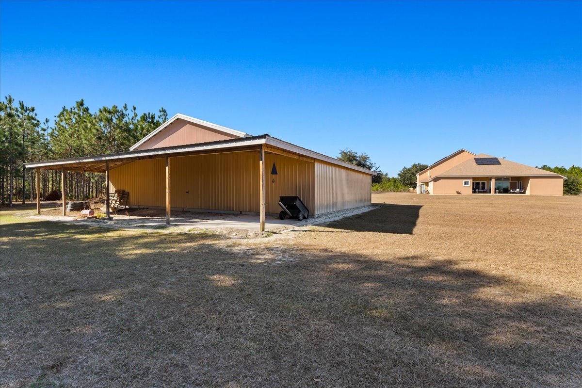 27247 Hallman Road Hilliard, FL 32046 - Photo 11 of 59 a front view of a house with a yard