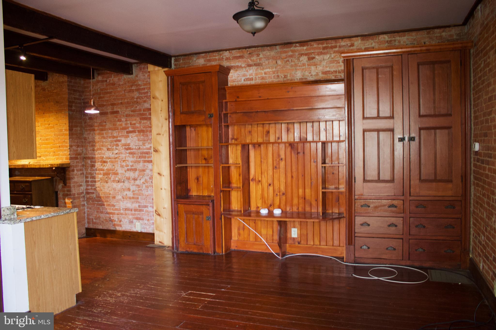 209 West Chestnut Street, Unit 2 West Chester, PA 19380 - Photo 4 of 23 en empty room with wooden floor and fan