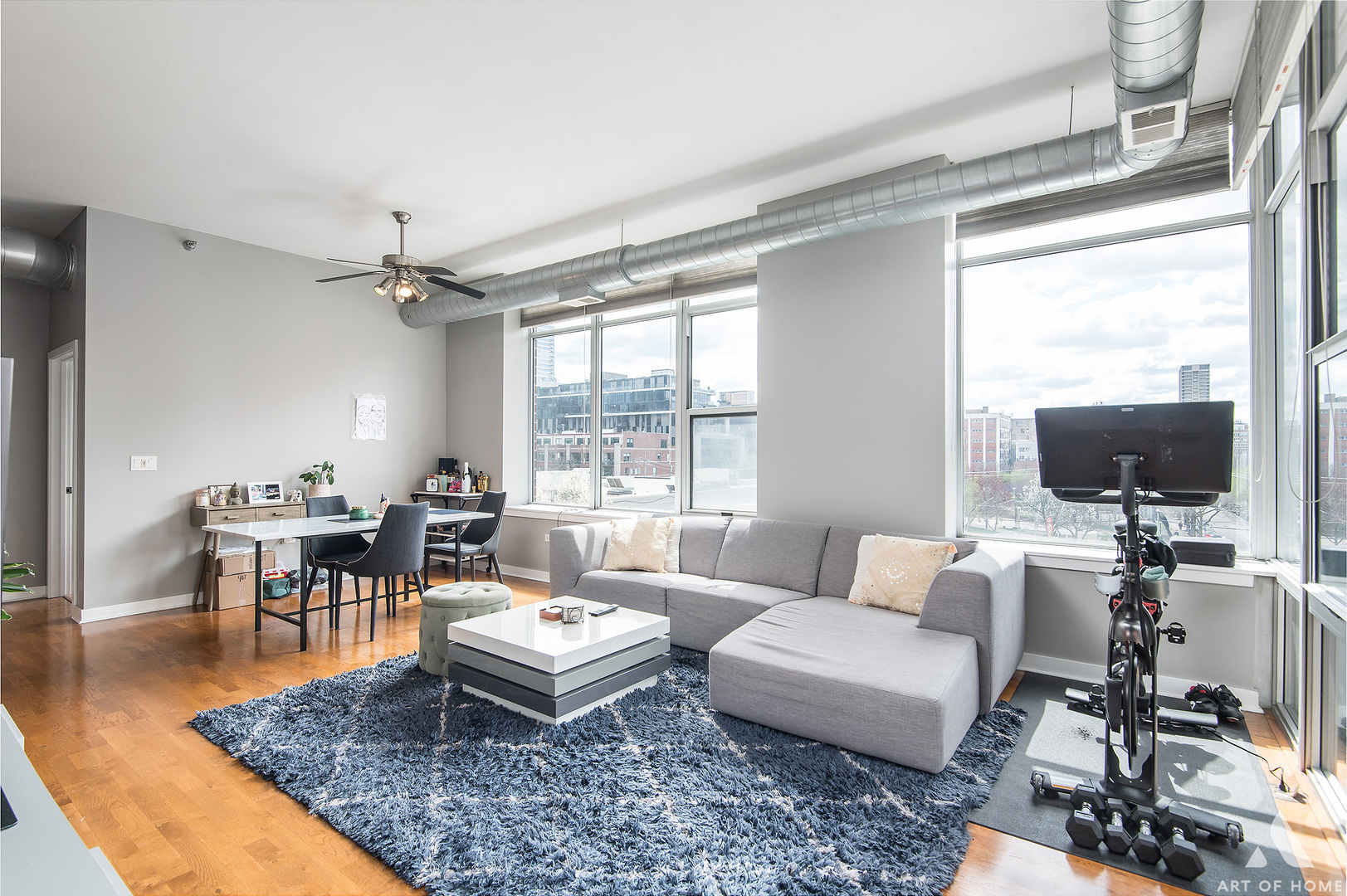901 West Madison Street, Unit 407 Chicago, IL 60607 - Photo 13 of 39 a living room with furniture a flat screen tv and a large window
