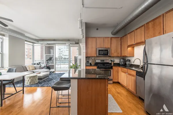a kitchen with granite countertop lots of counter top space and stainless steel appliances