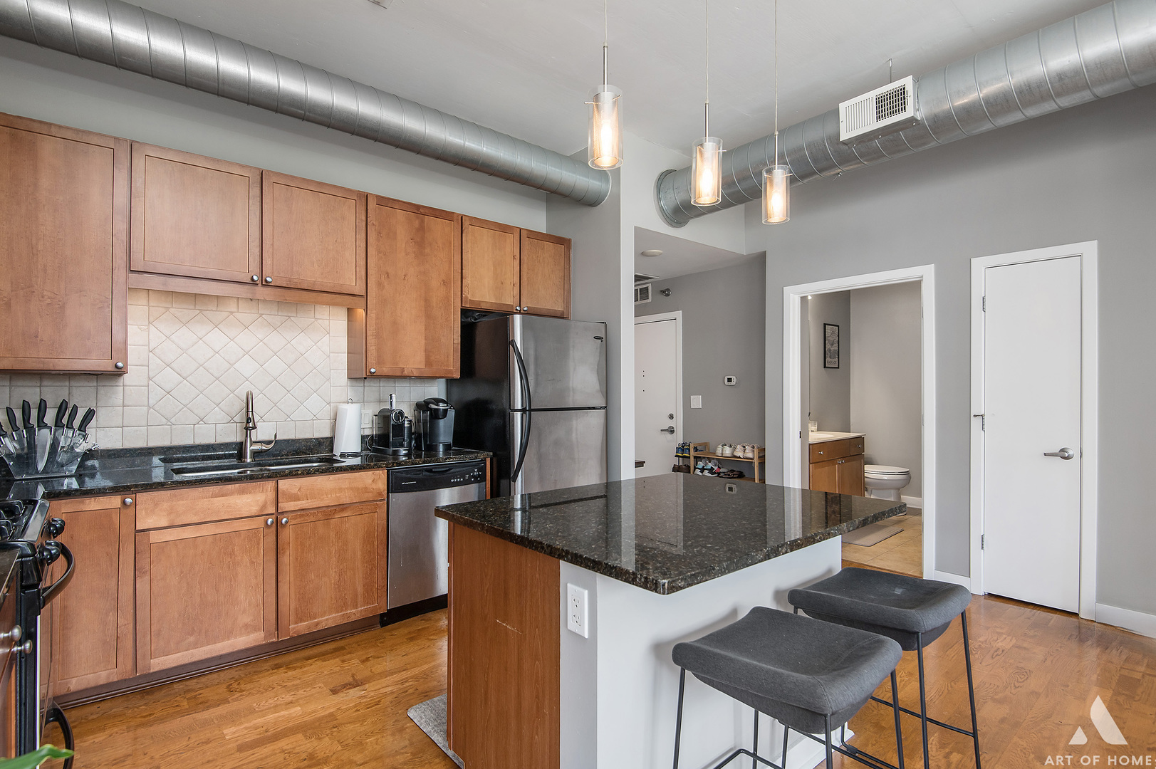 901 West Madison Street, Unit 407 Chicago, IL 60607 - Photo 17 of 39 a kitchen with granite countertop a sink stove and refrigerator