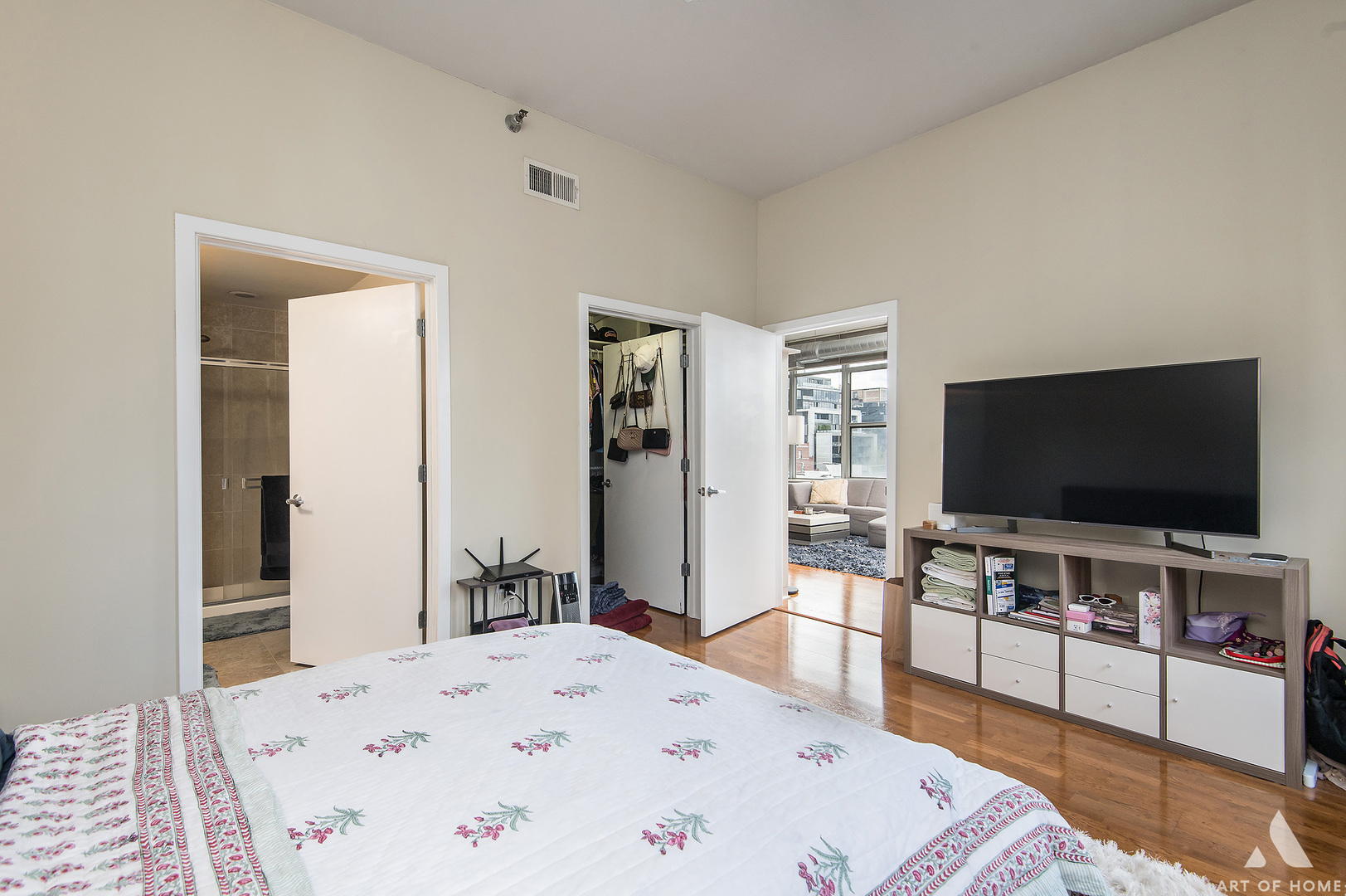 901 West Madison Street, Unit 407 Chicago, IL 60607 - Photo 19 of 39 a living room with a flat screen tv on wall and a flat screen tv