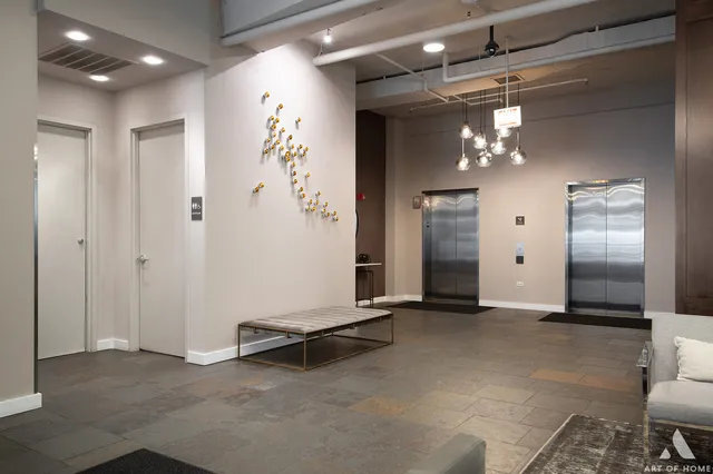 a view of a hallway with a chandelier
