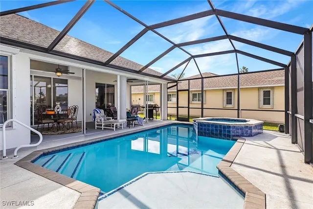 a view of a patio with swimming pool