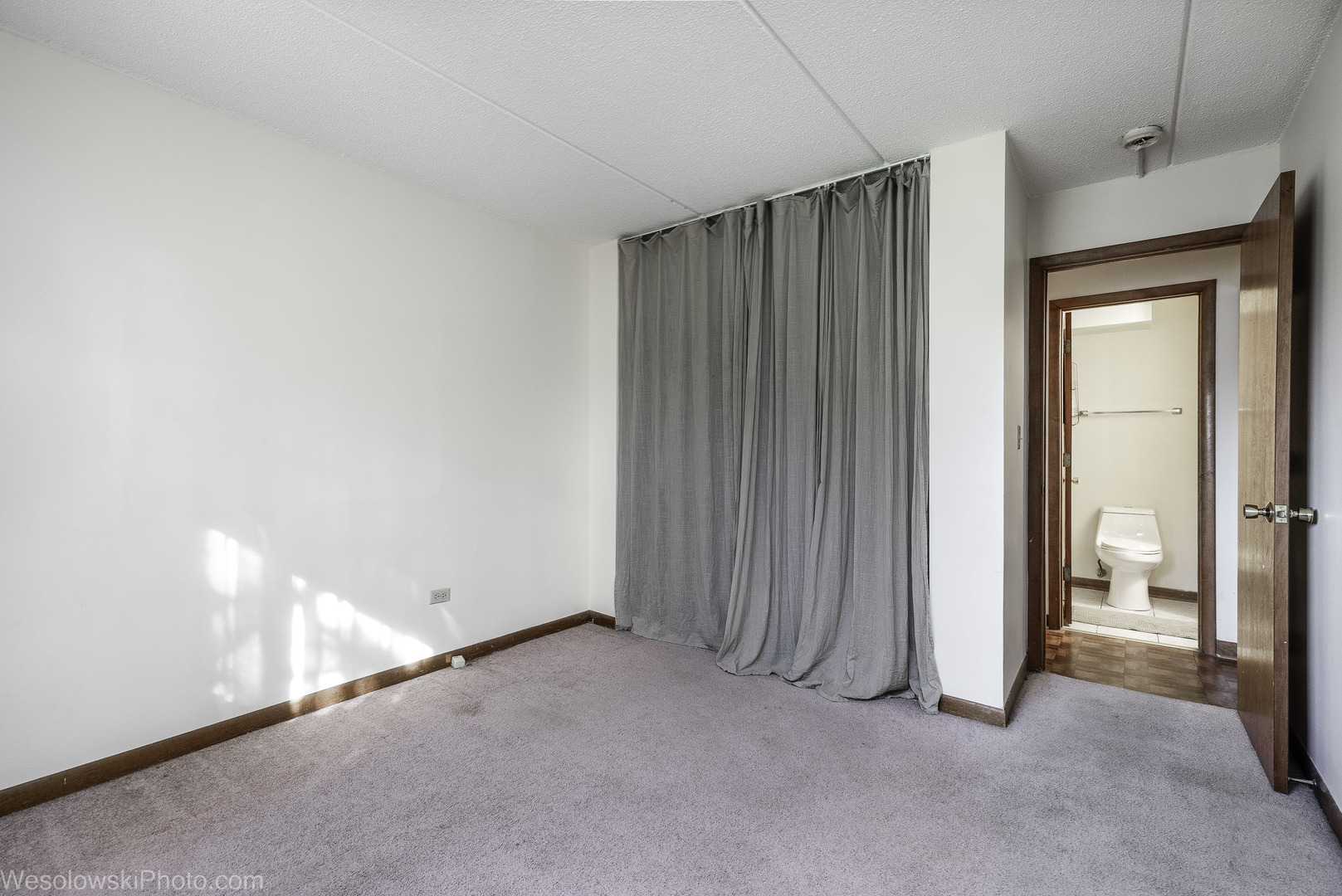 577 Fairway View Drive, Unit 1J Wheeling, IL 60090 - Photo 16 of 26 an empty room with windows