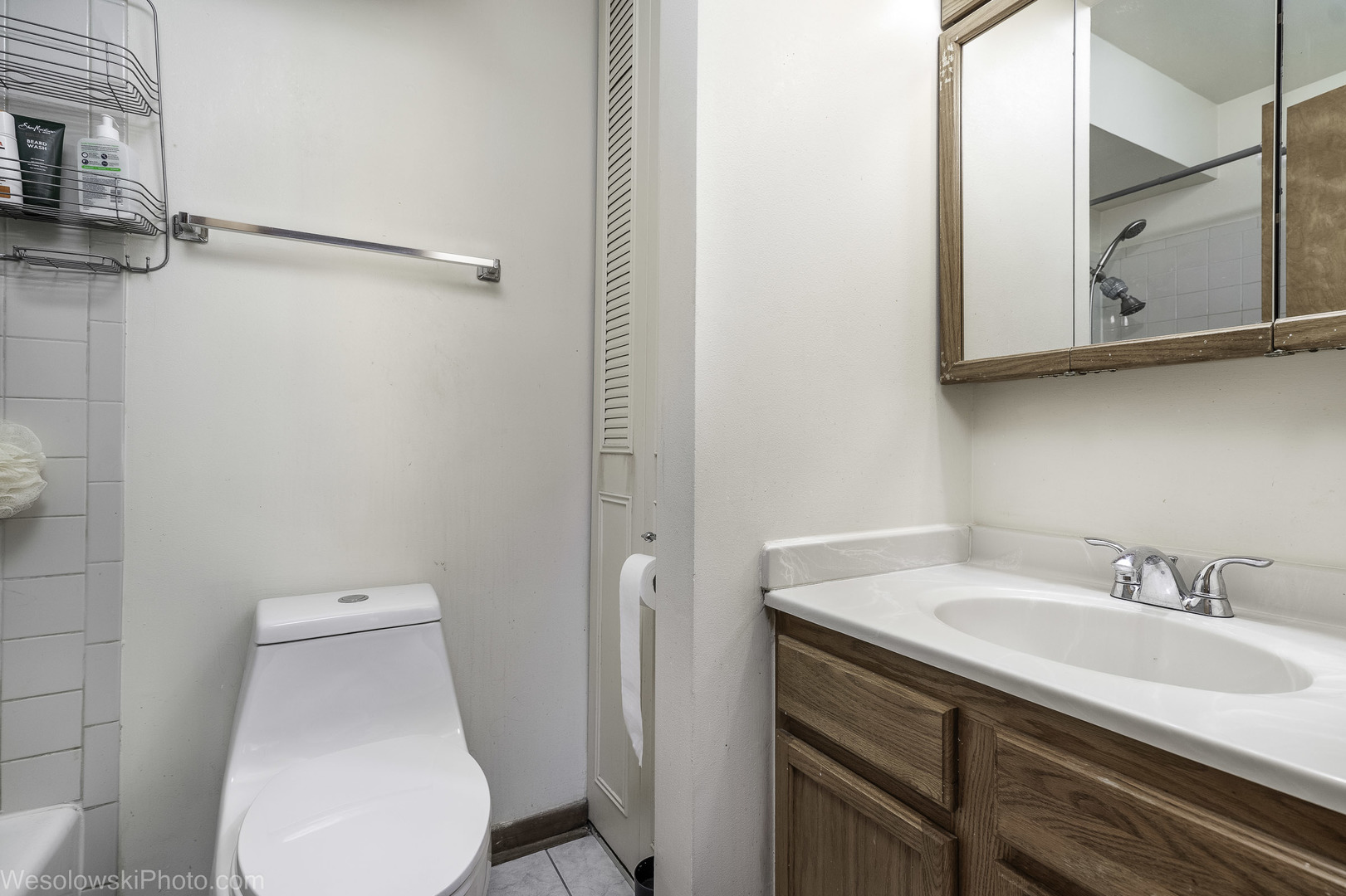 577 Fairway View Drive, Unit 1J Wheeling, IL 60090 - Photo 17 of 26 a bathroom with a sink a toilet and a mirror