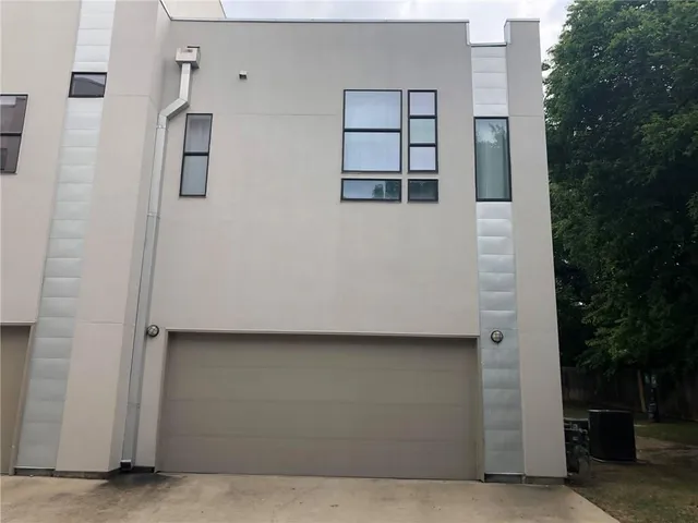 a building with glass door and outdoor space