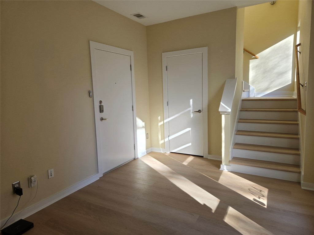 6000 South Congress Avenue, Unit 404 Austin, TX 78745 - Photo 4 of 23 a view of a livingroom with wooden floor and window