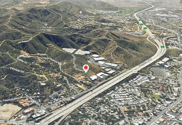 a view of a backyard of the house