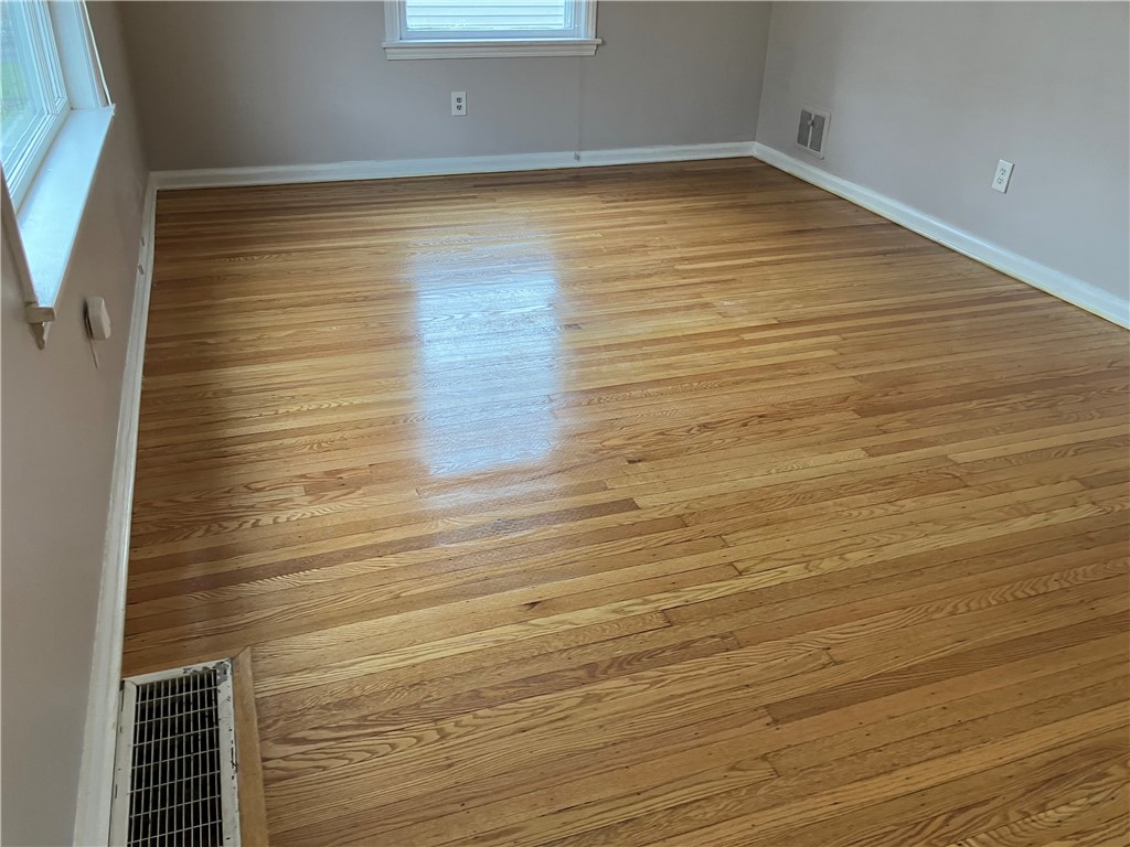 15 Maple Street Pittsford, NY 14534 - Photo 10 of 24
0ther view of living room oak floor.