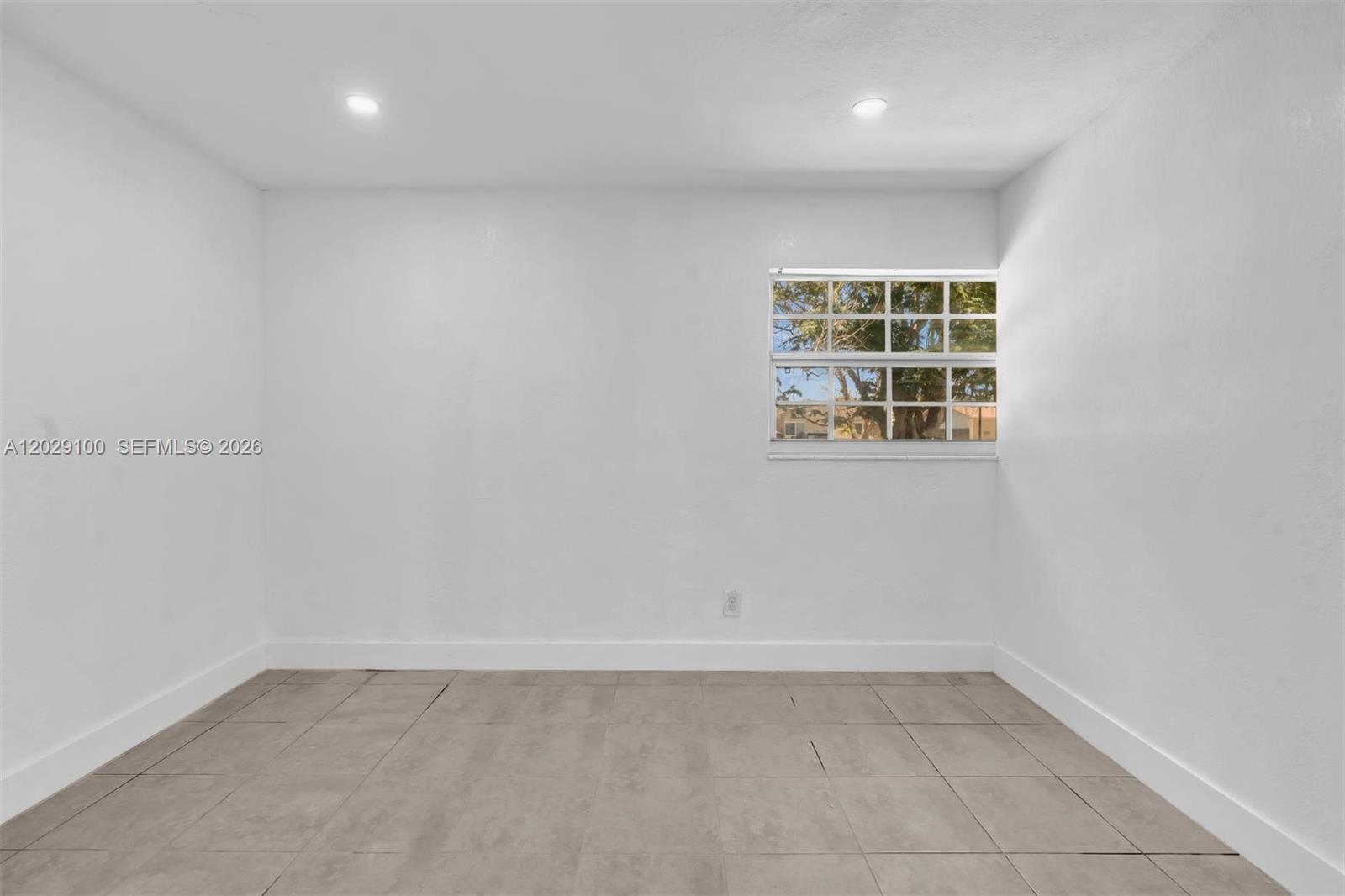 11790 Southwest 34th Street Miami, FL 33175 - Photo 30 of 56 an empty room with a window