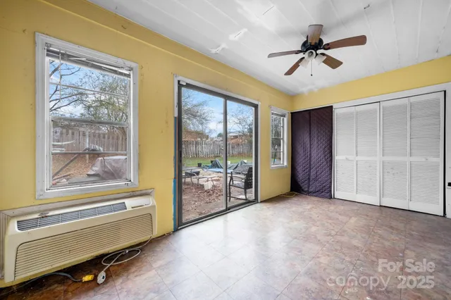 a view of an empty room with a window