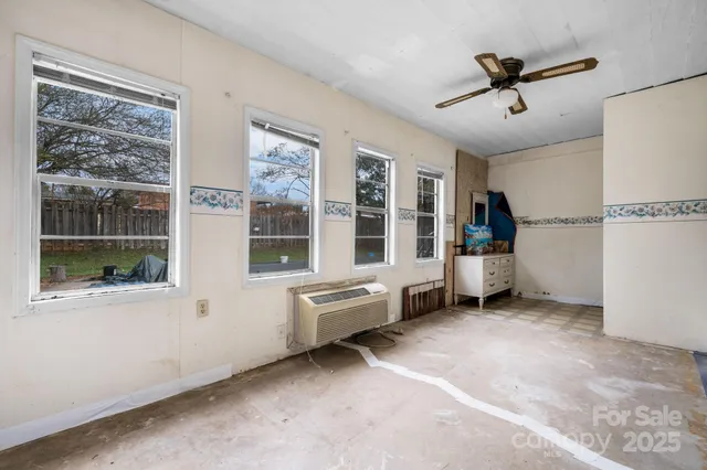 a view of an empty room with a window