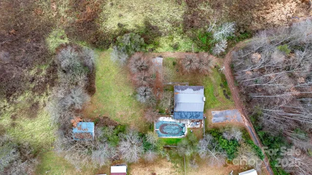 an aerial view of a house with outdoor space