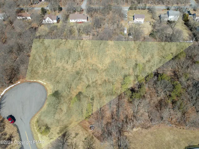 an aerial view of residential house with outdoor space