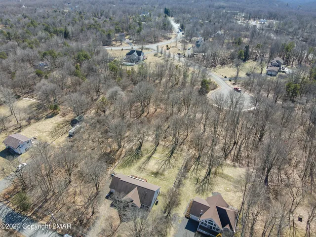 a aerial view of a house with a yard