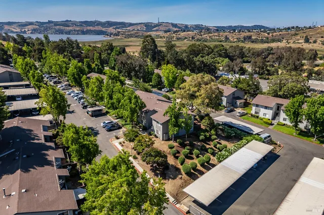 an aerial view of a house with a yard