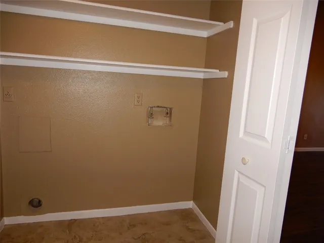 a view of a balcony with wooden floor