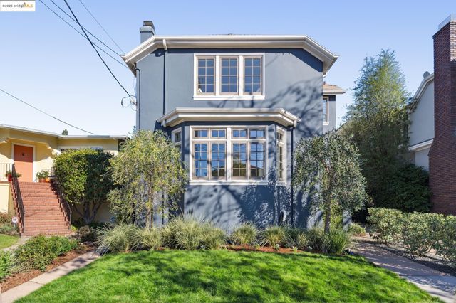 a view of a chairs and table in a balcony