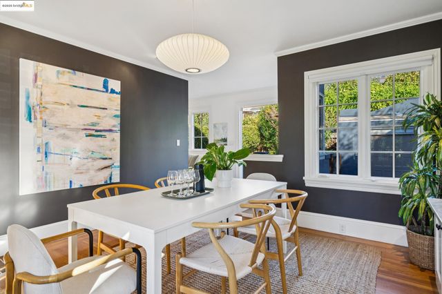 a view of a house with a backyard and sitting area