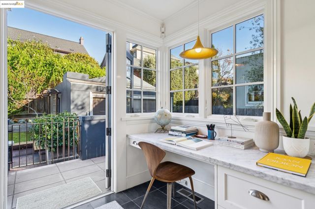 a room with a large window and a table