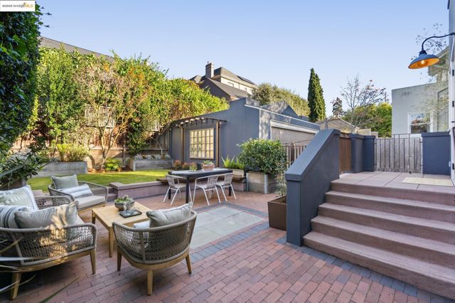 a very nice looking dining room with kitchen island furniture and a rug