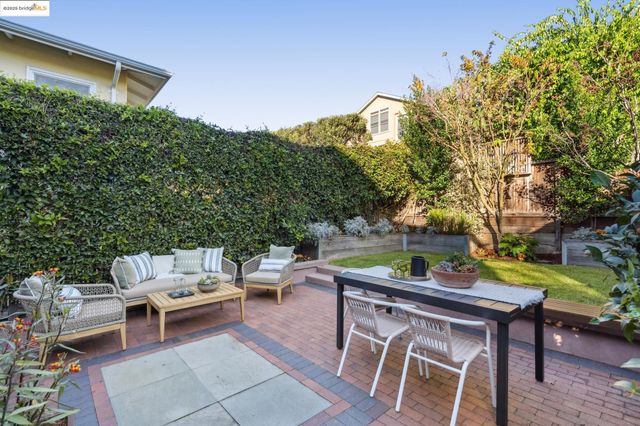 a kitchen with a table chairs stove and cabinets