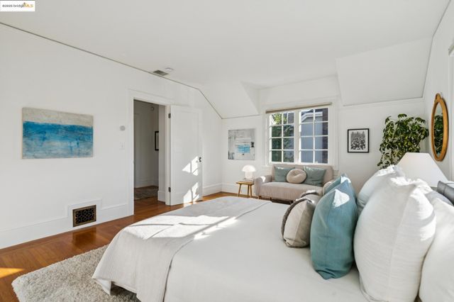 an aerial view of a chairs and table on the wooden floor