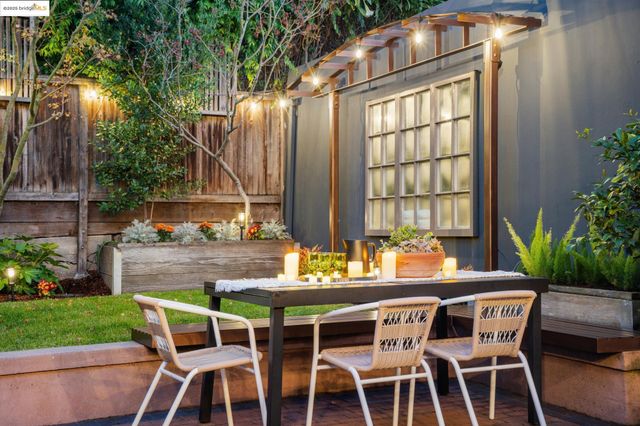 a view of a house with a yard porch and sitting area