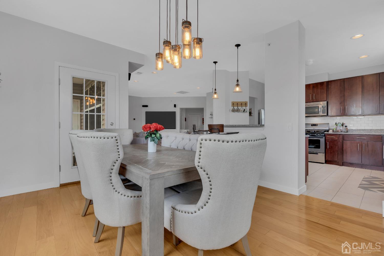 142 Tower Boulevard Piscataway, NJ 08854 - Photo 9 of 38 a living room with kitchen island furniture and a chandelier