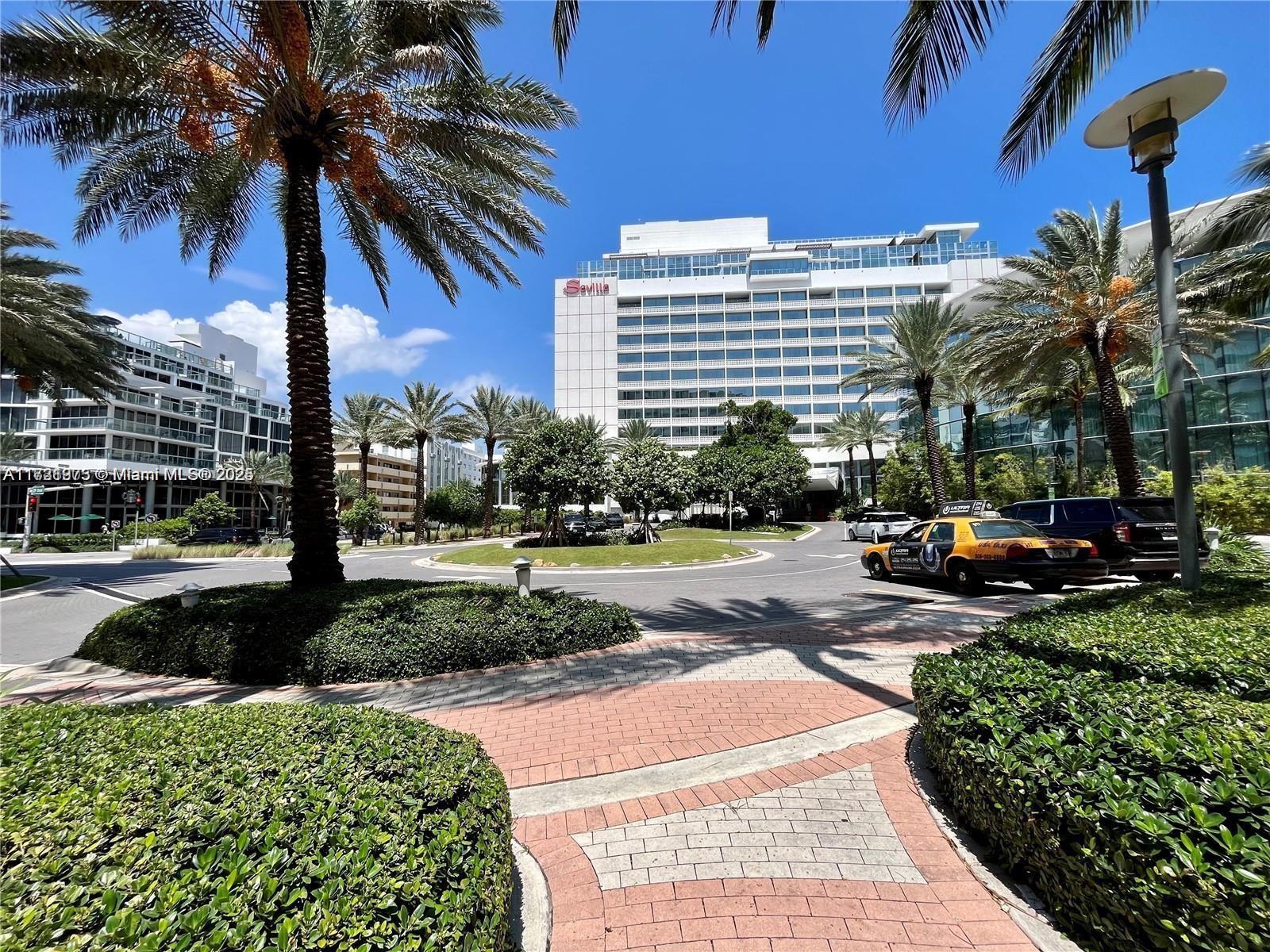2899 Collins Avenue, Unit 548 Miami Beach, FL 33140 - Photo 20 of 22 a view of a street with a cars parked in front of it