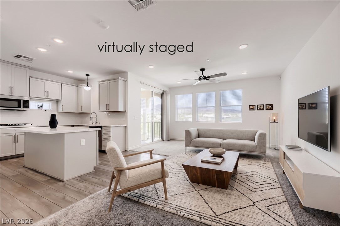 2555 Hampton Road, Unit 9301 Henderson, NV 89052 - Photo 5 of 36 An open-concept living space integrates a well-appointed kitchen with a comfortable lounge area.