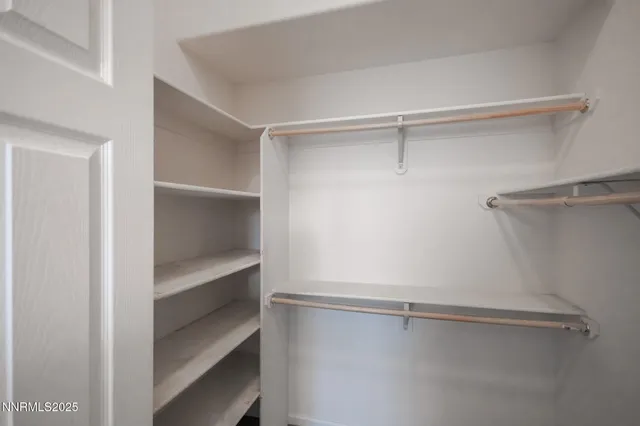 a view of an empty walk in closet