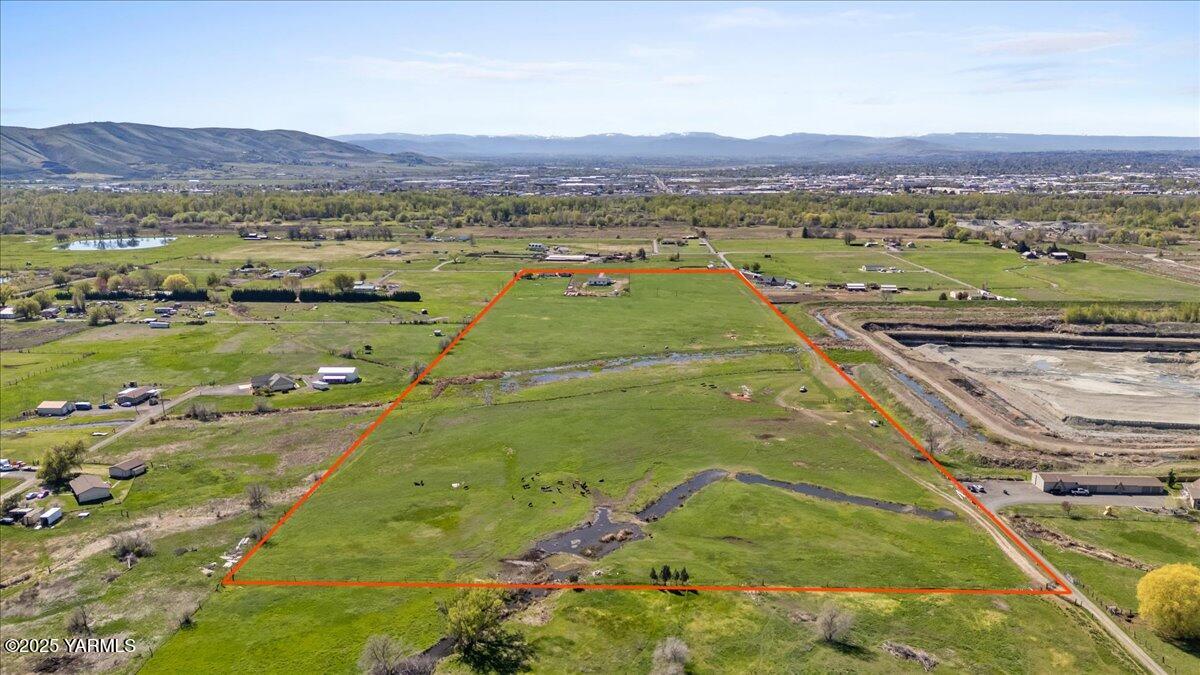 Nka Birchfield Road West, Unit LOT # 1C Yakima, WA 98901 - Photo 2 of 8 a view of a city with mountains in the background